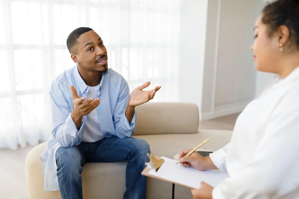 Patient speaking with provider during psychiatric consultation